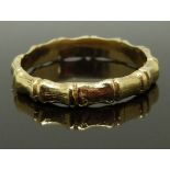 A 9ct gold ring with bamboo effect, size P, 2.53g