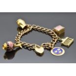 A 9ct gold charm bracelet with four 9ct gold charms one in the form of a vase, a jug, a Swedish