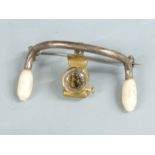 Early 20thC  cycling interest brooch formed as a pair of handlebars with lamp below, width 3.5cm