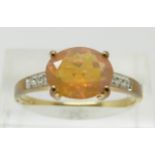 A 9ct gold ring set with an oval cut opal and diamonds,  2.1g, size S