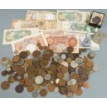 A collection of UK and overseas coins and banknotes, coin holder etc in a cash tin, small silver