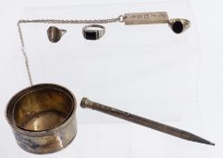 A collection of silver jewellery including an ingot and three rings, and a silver plated pen and cup