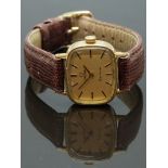 Omega ladies wristwatch ref. 511.413 with black hands and baton markers, gold dial, gold plated case