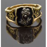 An early Victorian ring set with diamonds in the shape of a flower on black enamel ground, the