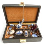 A collection of Delft jewellery including silver mounted pendants, bracelet, and brooches