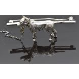 A silver brooch in the form of a Staffordshire bull terrier dog