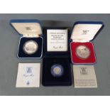 Three Royal Mint silver proof cased coins comprising Queen's Silver Jubilee, Charles and Diana