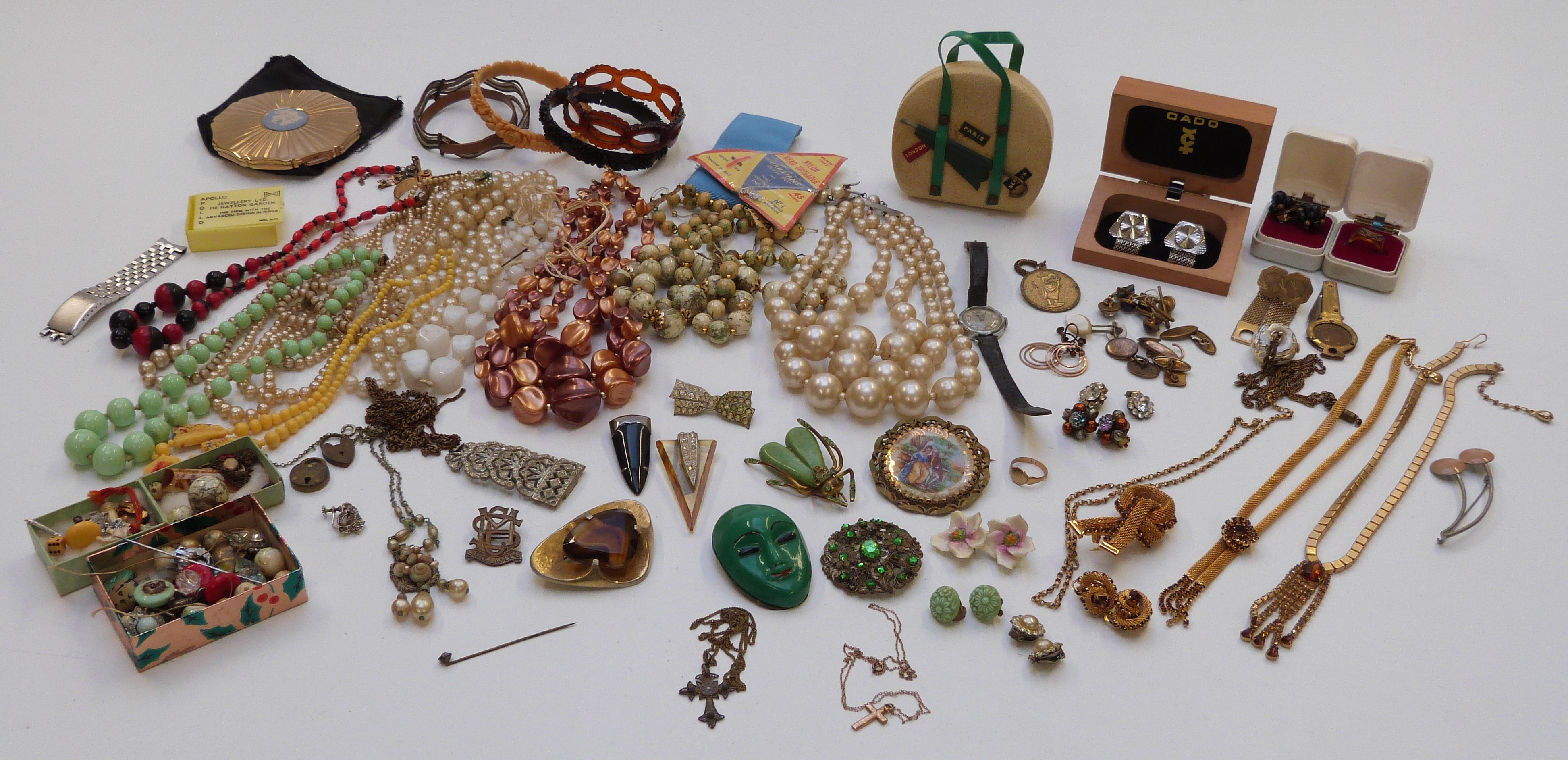 A collection of costume jewellery including beads, brooches, Art Deco clip, Czech fly brooch, etc