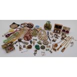 A collection of costume jewellery including beads, brooches, Art Deco clip, Czech fly brooch, etc