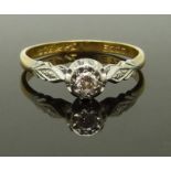 An 18ct gold ring set with a diamond in a platinum setting, 2.2g, size M