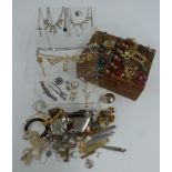 A collection of jewellery including diamanté, brooches, silver vesta, silver spoon, silver pendants,