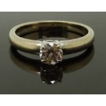 An 18ct white gold ring set with a round cut diamond of approximately 0.4ct, size O, 4.58g