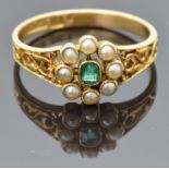 Victorian 18ct gold ring set with an emerald surrounded by seed pearls, with filigree shoulders
