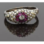 Georgian / Victorian ring set with an old cut diamond surrounded by rubies and seed pearls, size M