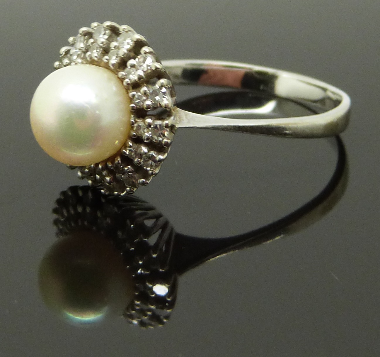 An 18ct white gold ring set with a pearl surrounded by diamonds, size R, 4.89g - Image 2 of 2