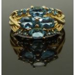 A 14ct gold ring set with blue topaz, size N/O, 3.66g