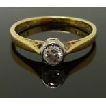 An 18ct gold ring set with a diamond of approximately 0.2ct, size M, 2.3g