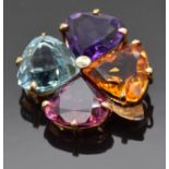 A four leaf clover brooch set with trilliant cut Brazilian aquamarine, amethyst, citrine and garnet