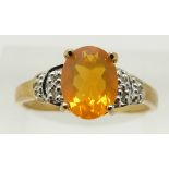 A 9ct gold ring set with an oval cut fire opal and diamonds, 1.7g, size N