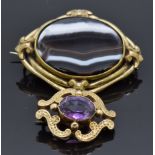 Victorian yellow metal brooch set with an amethyst and a Victorian agate brooch