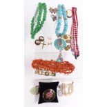 A collection of jewellery including coral, jade style quartz and turquoise style necklaces, silver