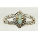 A 9ct gold ring set with two trilliant cut Paraiba opals and topaz, 2.8g, size N