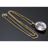 Edwardian 9ct gold pendant set with an oval quartz on a 9ct gold chain, 7.5g