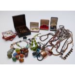 A collection of costume jewellery including enamel cufflinks, necklaces, brooches, etc