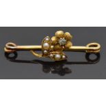 Edwardian 15ct gold brooch in the form of a flower set with a diamond to the centre and pearls to