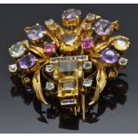 A yellow metal pin / brooch set with square cut sapphires, citrine, amethyst, aquamarines and