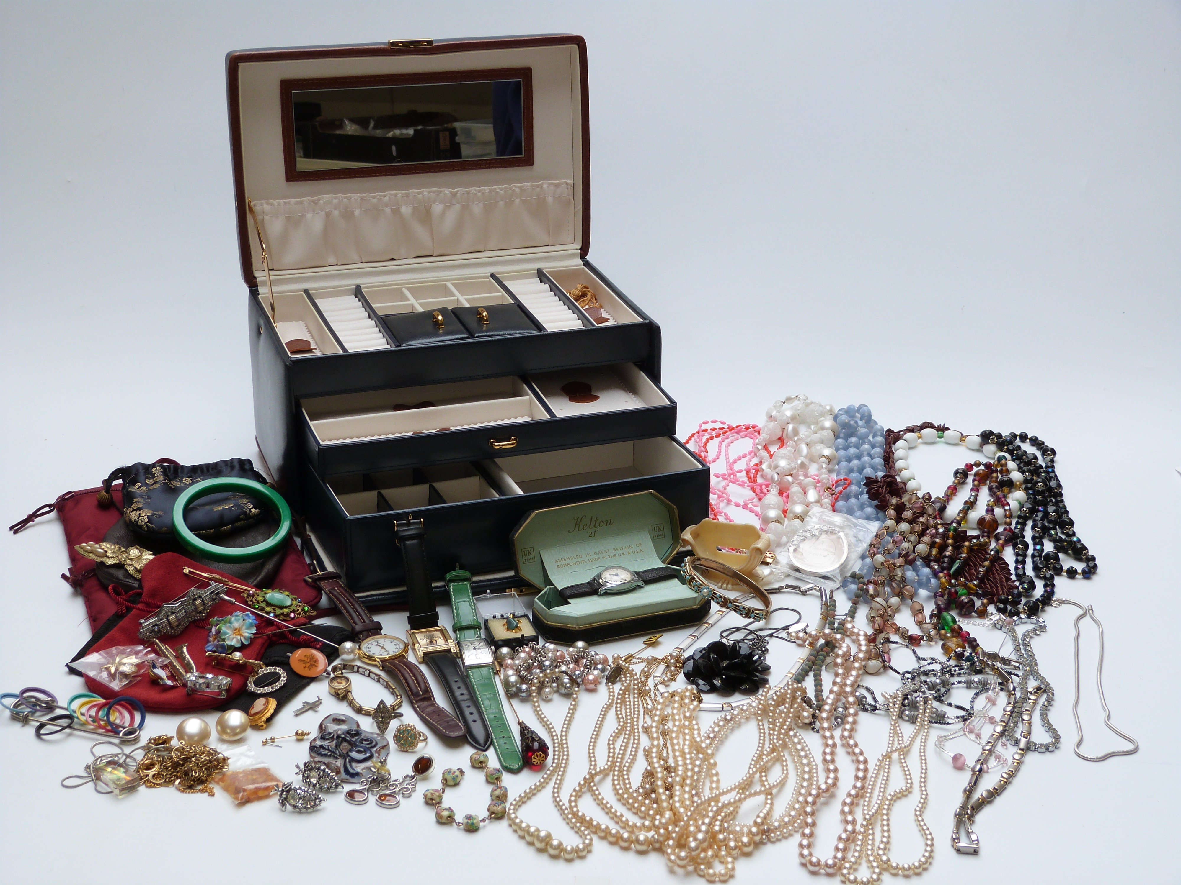 A large collection of costume jewellery including beads, vintage watch, faux pearls, Czech brooch,