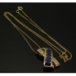 A 9ct gold pendant set with two synthetic sapphires and moonstones, 3.3g