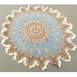 Turkish rosette shaped rug with light blue ground and floral field design, diameter 148cm