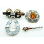 A white metal brooch in the form of a horseshoe set with agate, a Scottish white metal kilt pin/