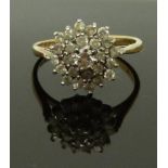 A 9ct gold ring set with a cluster of diamonds, size M, 2.41g