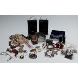 A collection of jewellery including necklaces, bracelets, brooches, etc