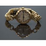 Swiss 9ct gold ladies wristwatch with blued hands, black Roman numerals, silver dial, gilt minute