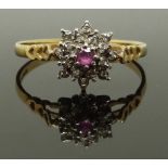 A 9ct gold ring set with a ruby and diamonds, 1.6g, size O/P