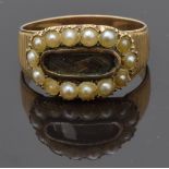 Georgian mourning ring set with plaited hair to the centre surrounded by seed pearls and ridged