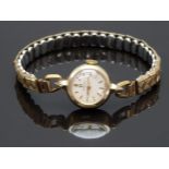 Omega 9ct gold ladies wristwatch with gold hands and markers, silver dial and signed 17 jewel