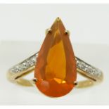 A 9ct gold ring set with a pear cut fire opal and diamonds, 3g, size N