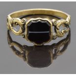 Victorian ring set with a cartouche shaped section of banded agate and with pierced foliate