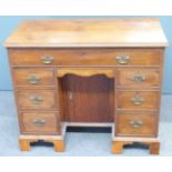 Victorian mahogany knee hole desk with brass drop handles and full width drawer above a further