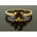 A 9ct gold ring set with citrine and diamonds, size N, 2.30g