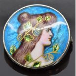 Art Nouveau silver brooch set with enamel depicting a young woman, signed to back, 2.2cm diameter