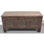 A 17th/18thC oak coffer with carved decoration, W107 x D37 x H53cm