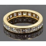French 18ct gold eternity ring set with 21 square step cut diamonds' each approximately 0.15ct,