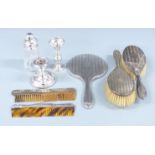 Hallmarked silver dressing table items comprising hand mirror, two combs and two brushes, silver