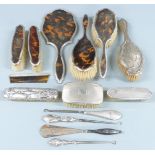 Hallmarked silver mounted dressing table items comprising tortoiseshell mounted set of hand mirror