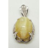 A 9ct white gold pendant set with an oval cat's eye opal cabochon and diamonds, 4.4g